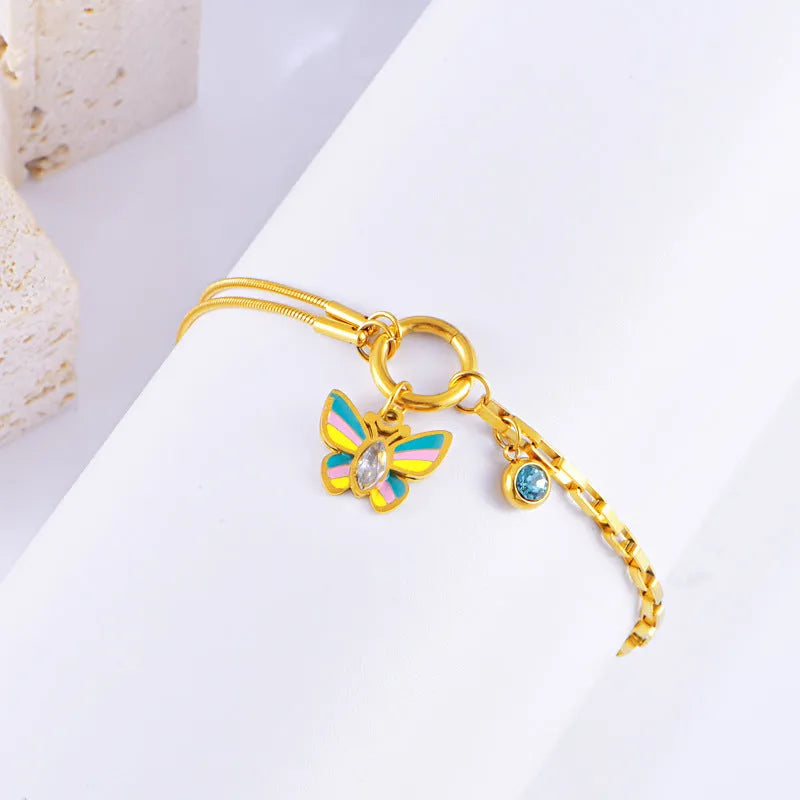 Gold-coloured epoxy butterfly necklace and bracelet set with titanium steel snake bones chain