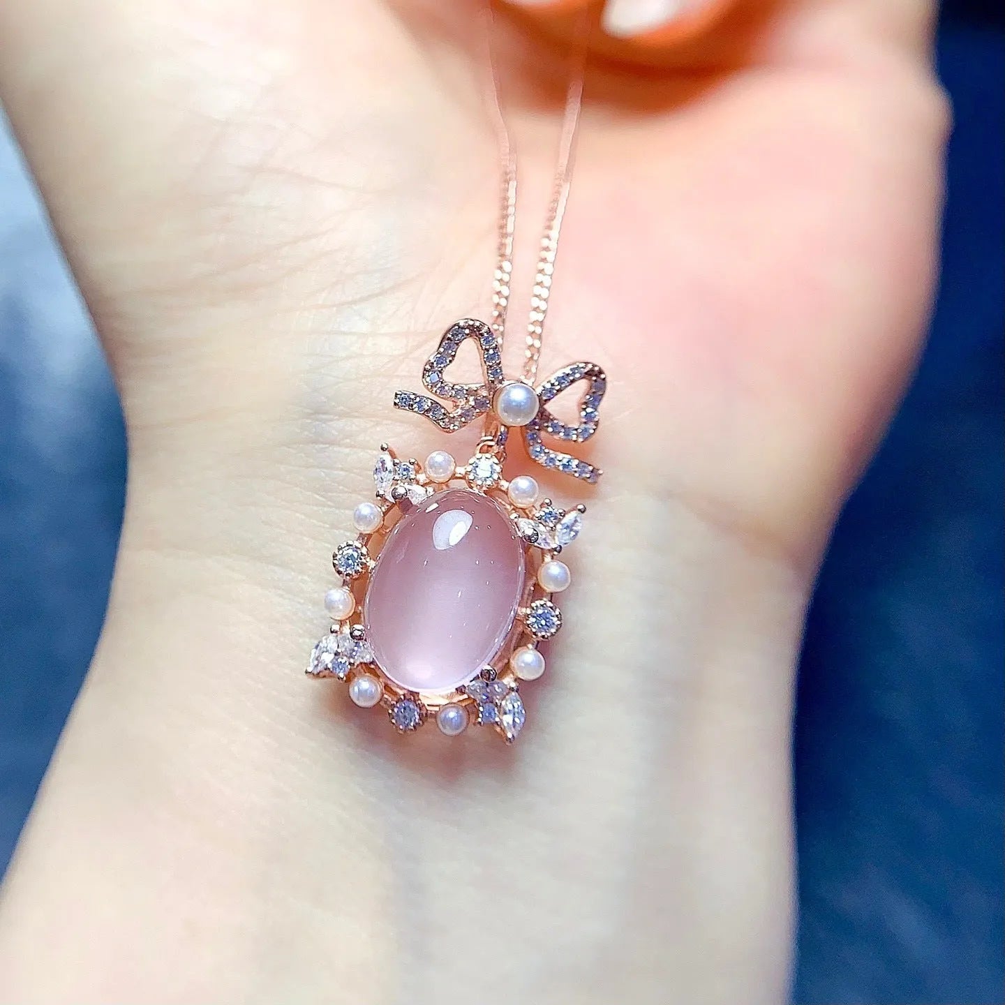 Geometric pendant necklace with pink rose quartz crystal in rose gold plated 925 silver setting.