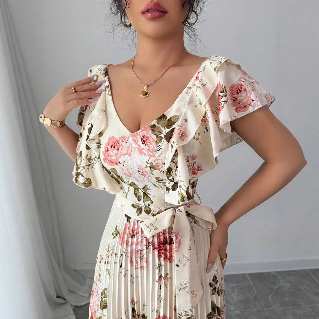 Apricot-coloured women's V-neck dress with a digital floral print, ruffled short sleeves, and a flowing oversized swing skirt.