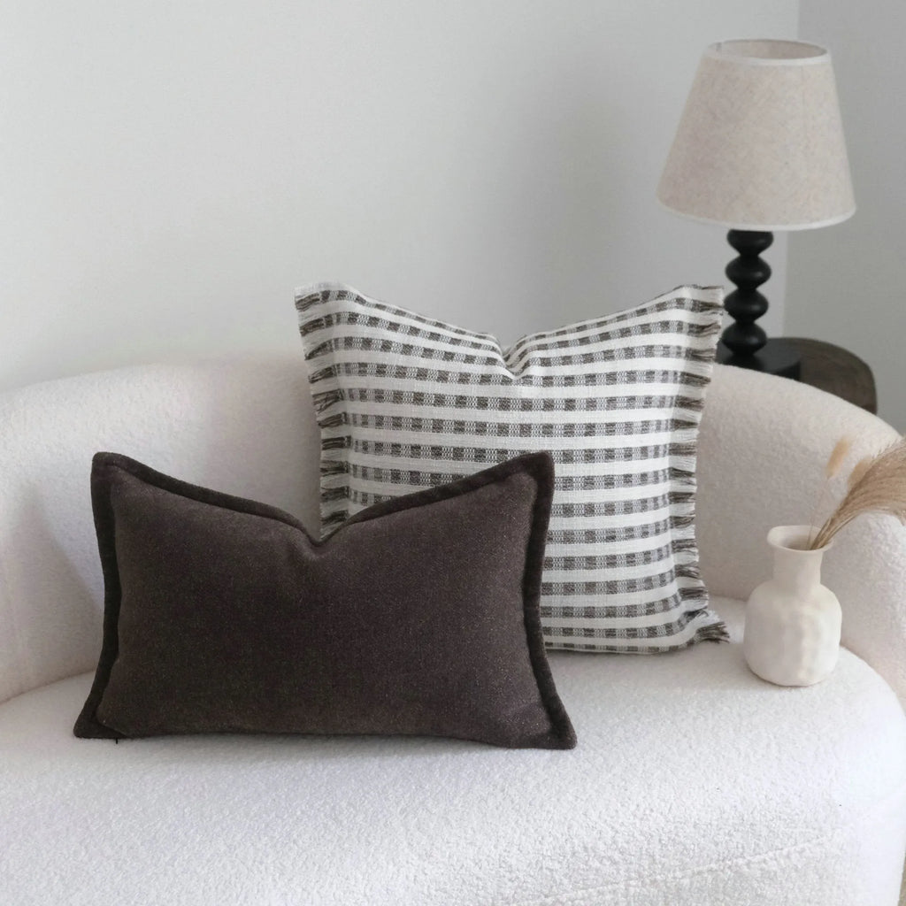 Coffee brown striped mid-century modern cushion with Chinese classical design on sofa