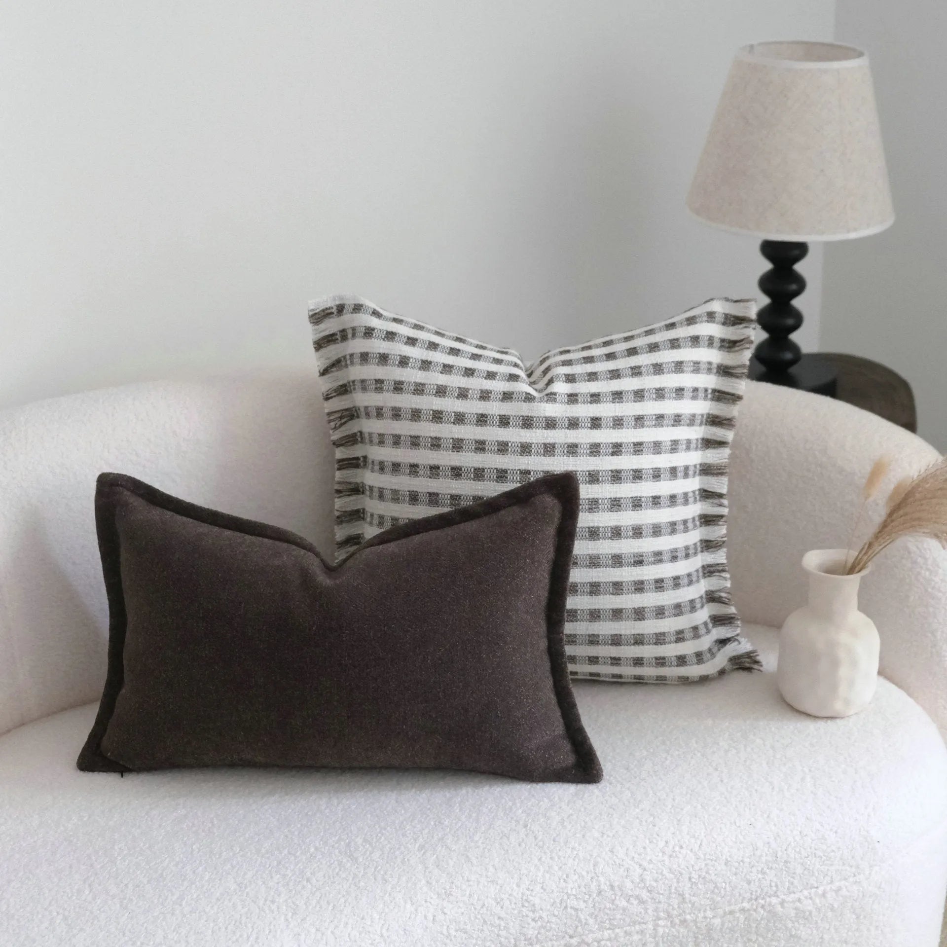 Coffee brown striped mid-century modern cushion with Chinese classical design on sofa