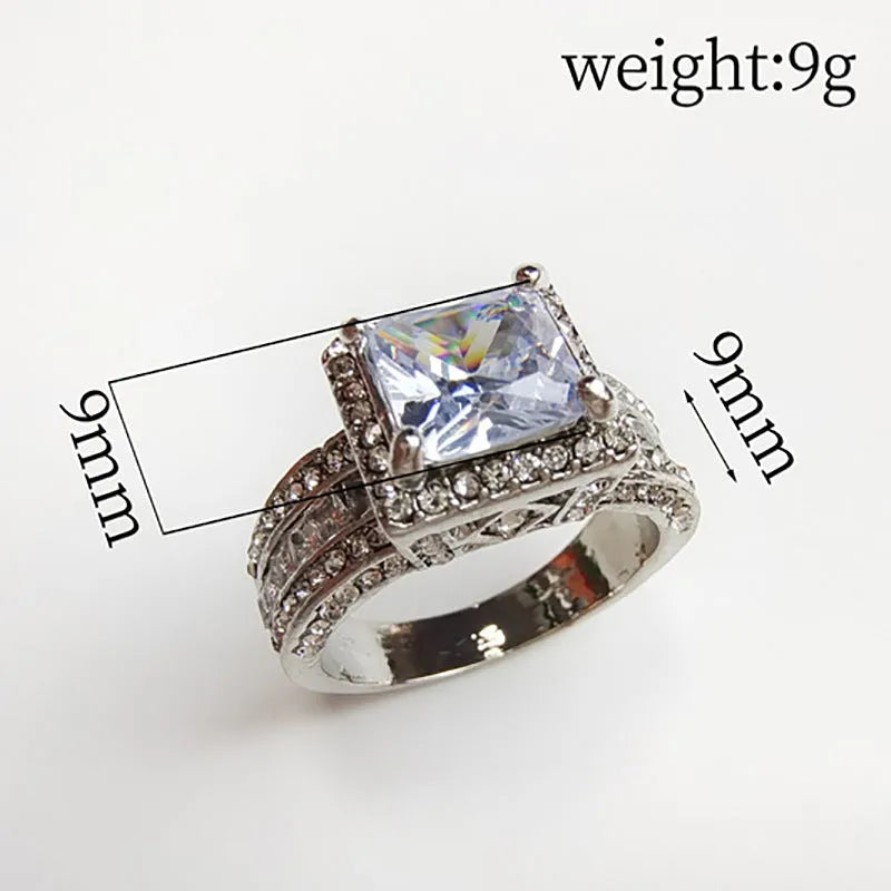 Women's geometric alloy ring with electroplated gold or white finish showing round design elements and available in sizes 5-13