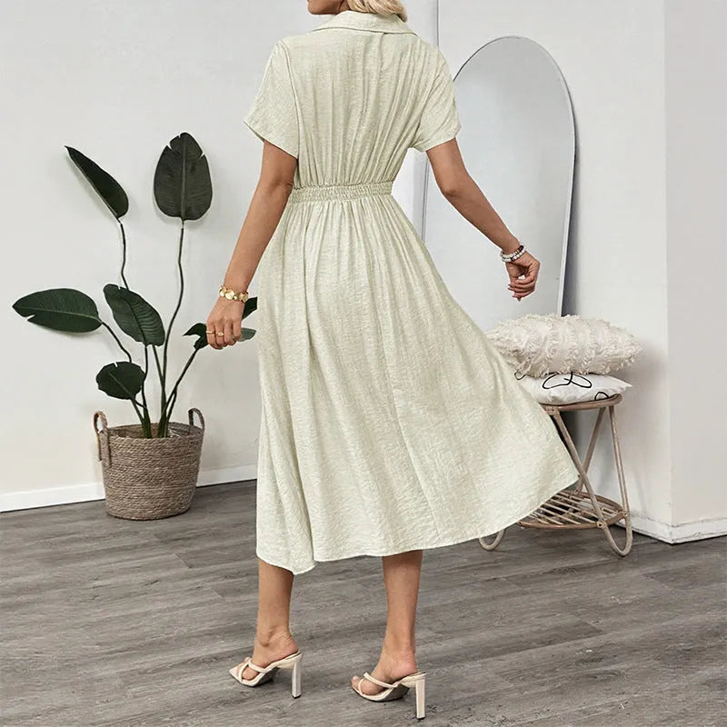 Light green women's shirt dress with lapel collar, waist tie, and side pockets.