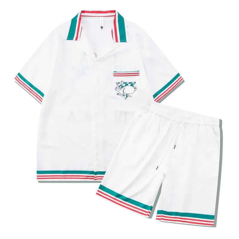 Men's plaid printed beach outfit set showing a short sleeve shirt and matching trousers on a manikin.