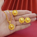 Gold electroplated floral design three-piece jewellery set showing necklace, earrings, and ring on water wave chain.