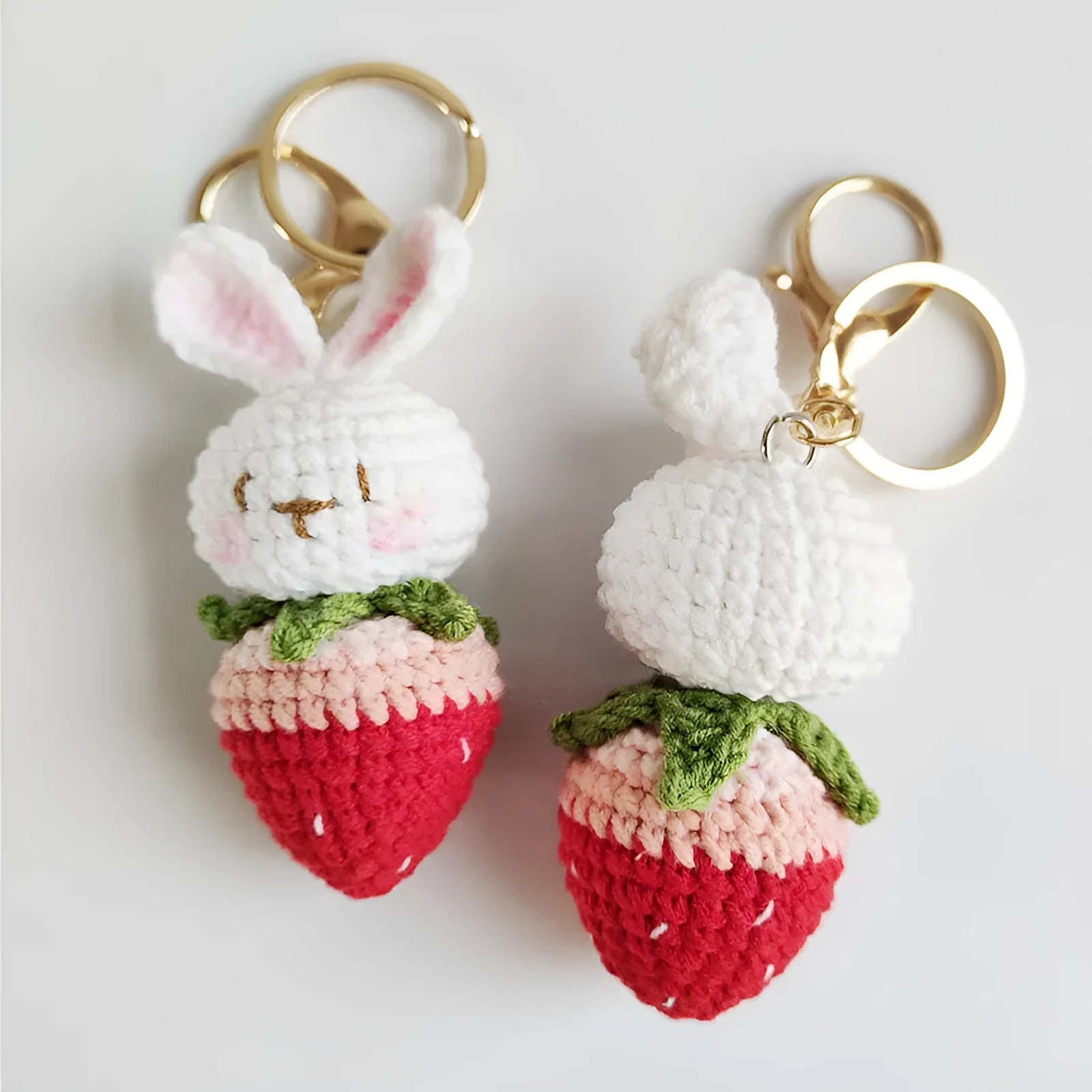 White hand-woven rabbit strawberry pendant charm with key attachment on four-strand doll wire