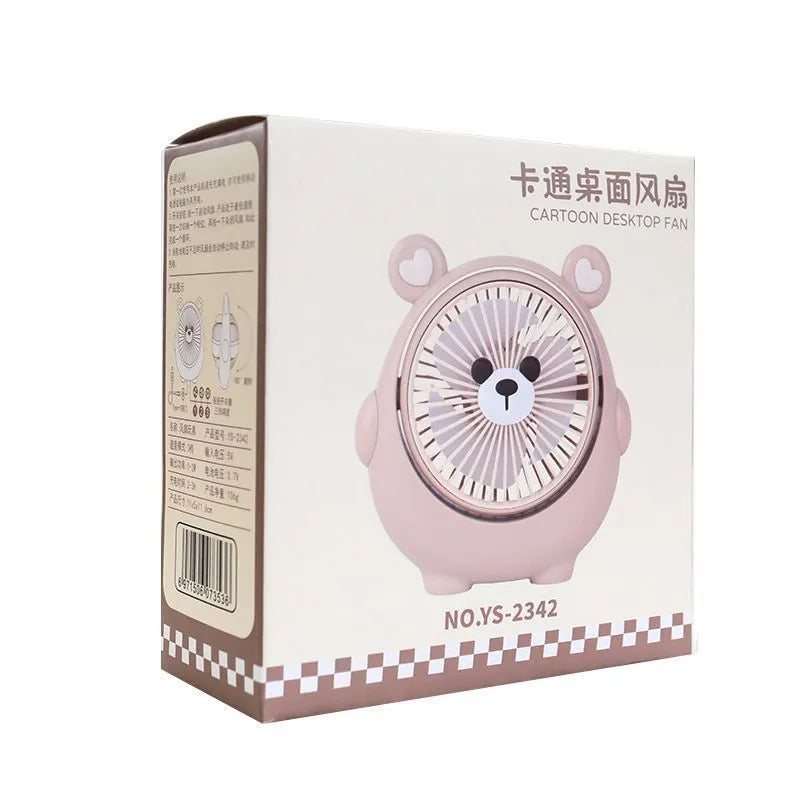 Cute dog design USB desktop electric fan in bear apricot colour on a wooden desk.