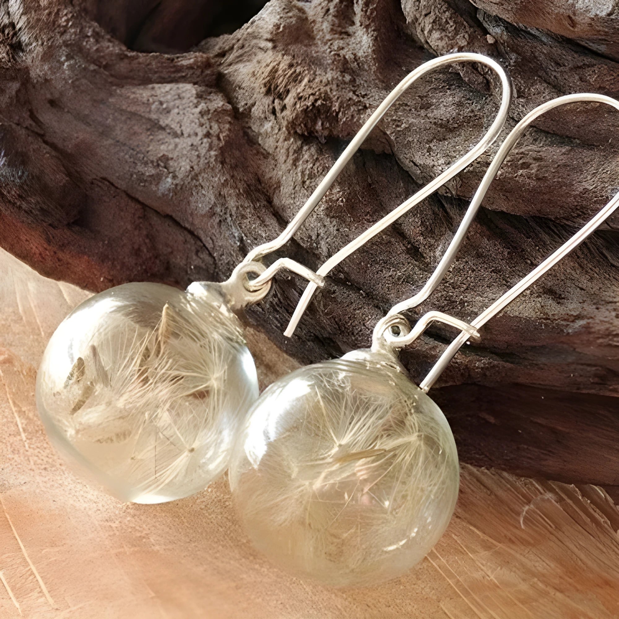 Transparent 16mm glass ball earrings with dandelion seed design and French hooks