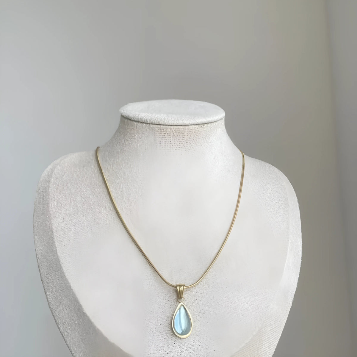 Retro blue and green water drop pendant necklace on a titanium steel snake bones chain.