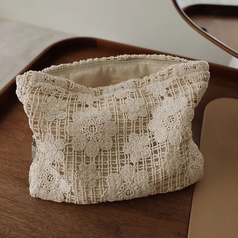 Handmade corduroy cosmetic bag with crocheted hollow flower pattern and ethnic embroidery in solid colour rope style