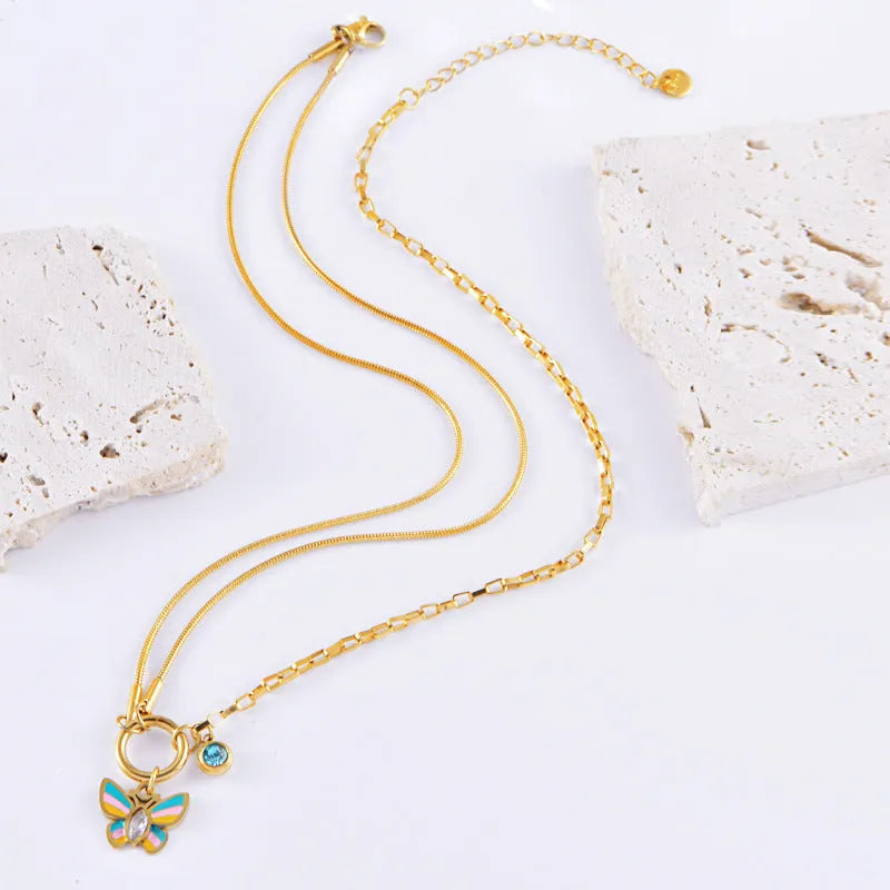 Gold-coloured epoxy butterfly necklace and bracelet set with titanium steel snake bones chain