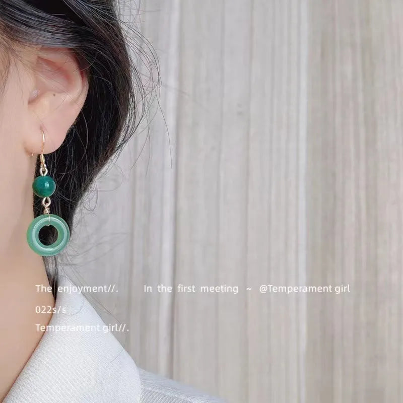Geometric peace buckle earrings in jade green with 14K gold plating and Chinese cheongsam design