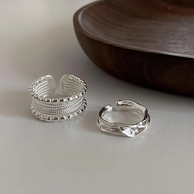 Adjustable copper alloy ring with woven twisted multilayer geometric design