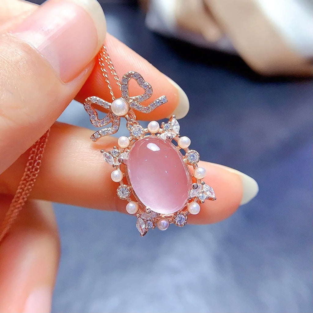 Geometric pendant necklace with pink rose quartz crystal in rose gold plated 925 silver setting.