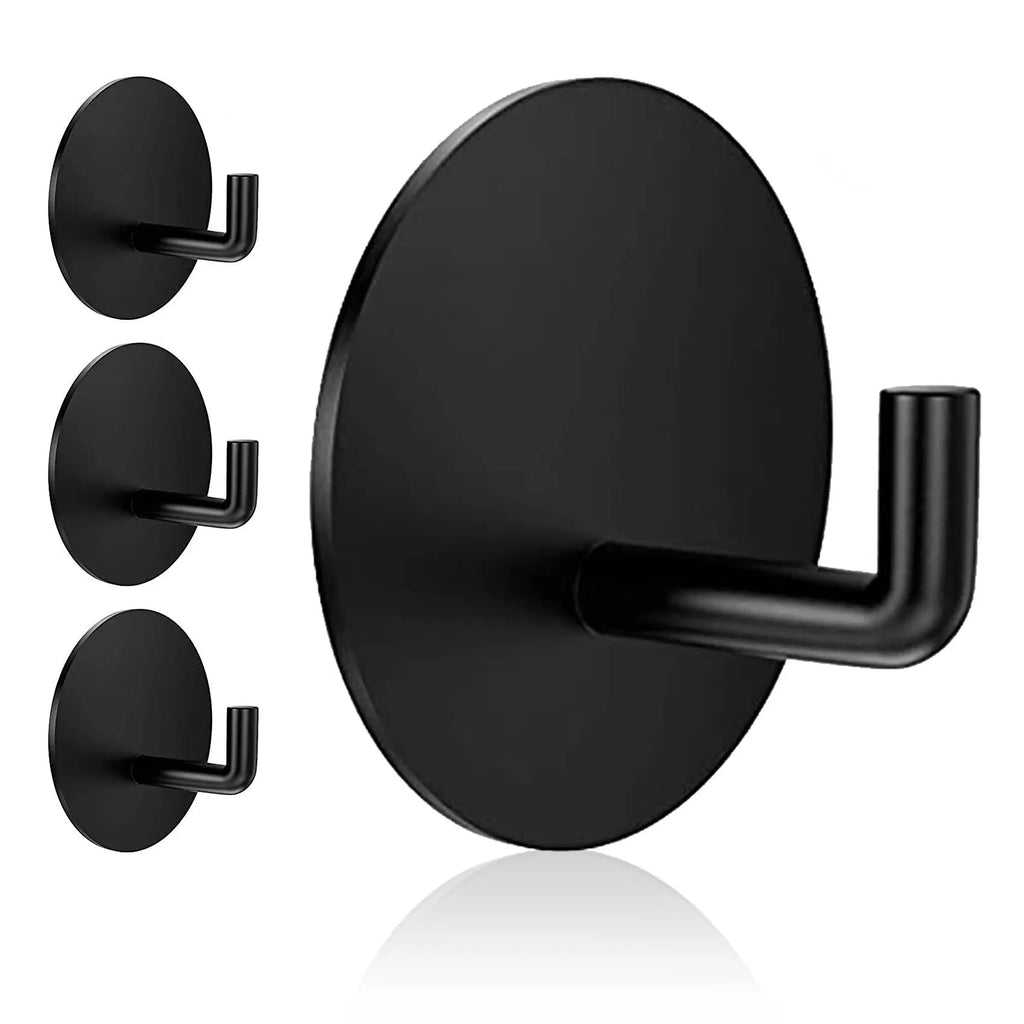 Pair of round stainless steel self-adhesive hooks, one black sanded and one polished, for bathroom or kitchen wall mounting.