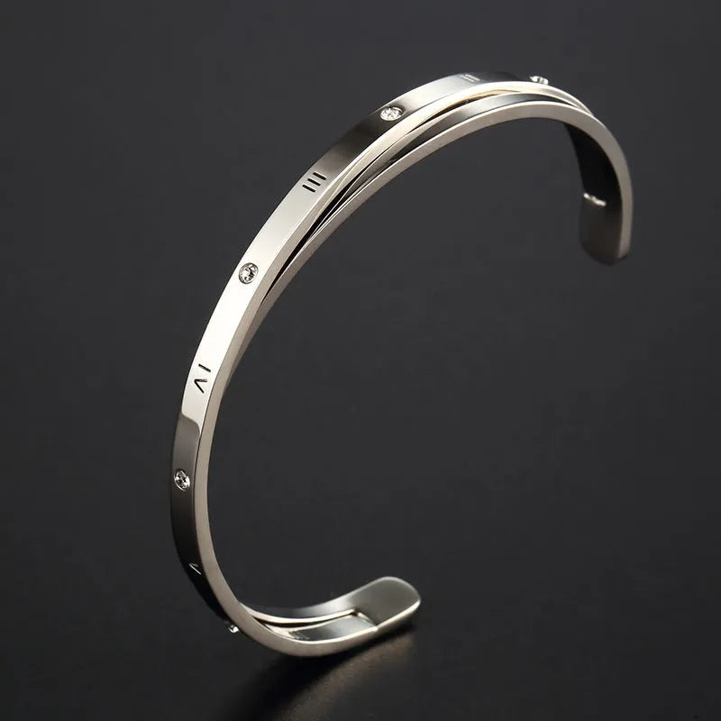 Open-ended stainless steel bracelet for women with inlaid zircon stones in rose, gold, or steel colour.