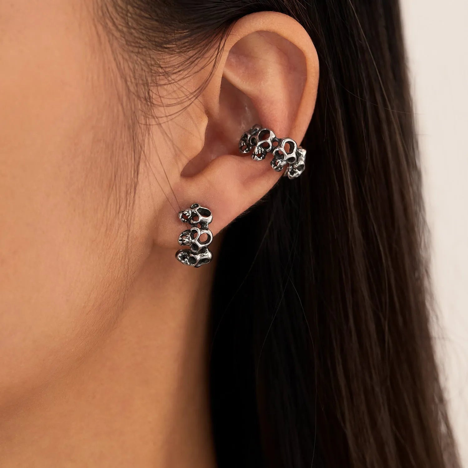 Stainless steel skull ear clips with hollow geometric design and clip mechanism