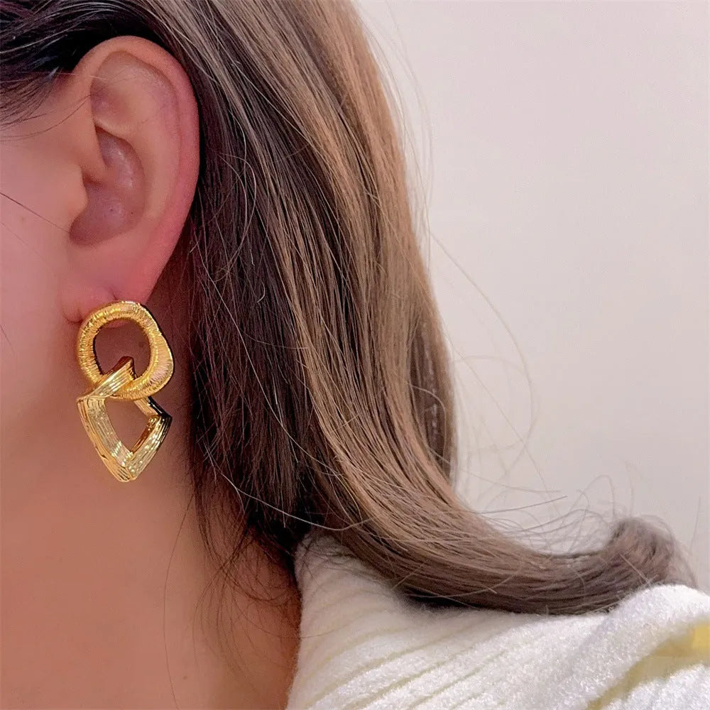 Retro geometric circle drop earrings in gold or silver finish measuring 3.4cm height