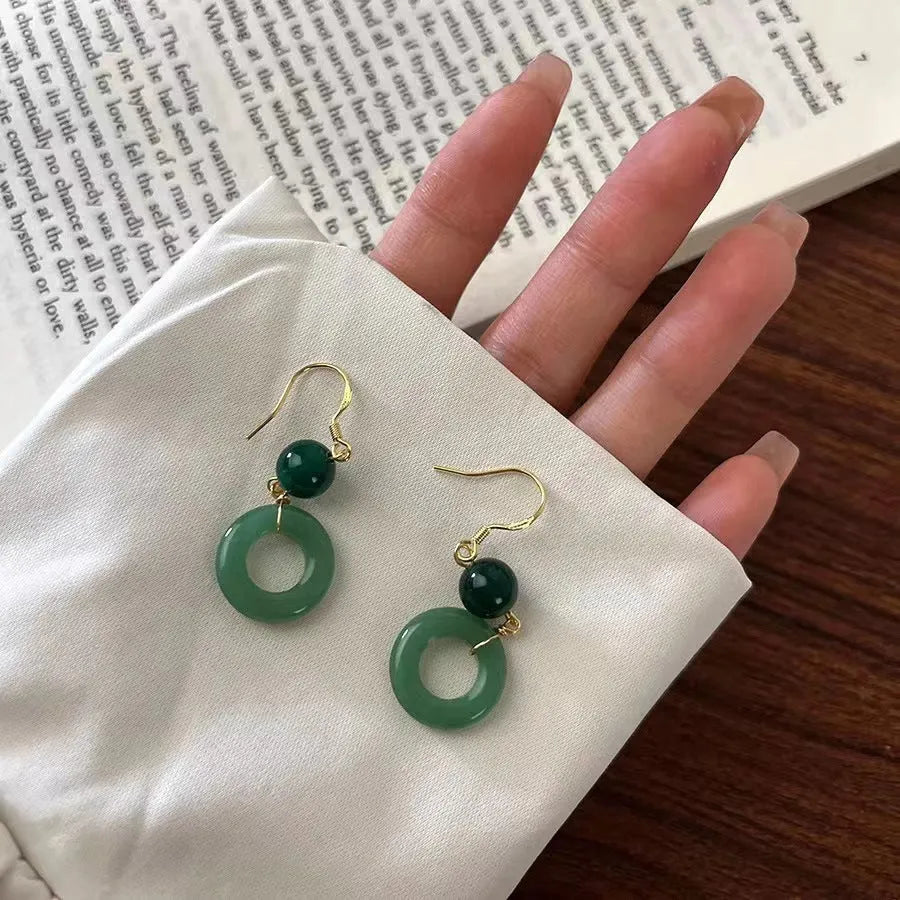 Geometric peace buckle earrings in jade green with 14K gold plating and Chinese cheongsam design