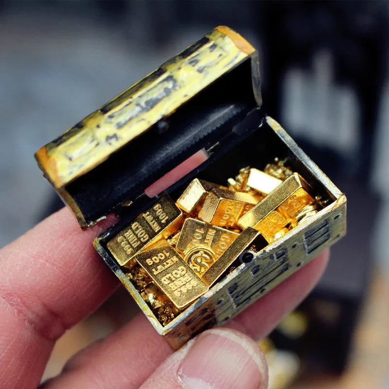 Miniature alloy treasure chest doll house ornament with gold coin and bar design.