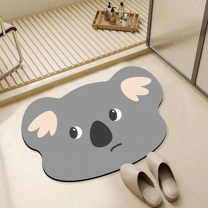 Thickened diatom ooze absorbent bathroom mat with cartoon animal design on a bathroom floor.