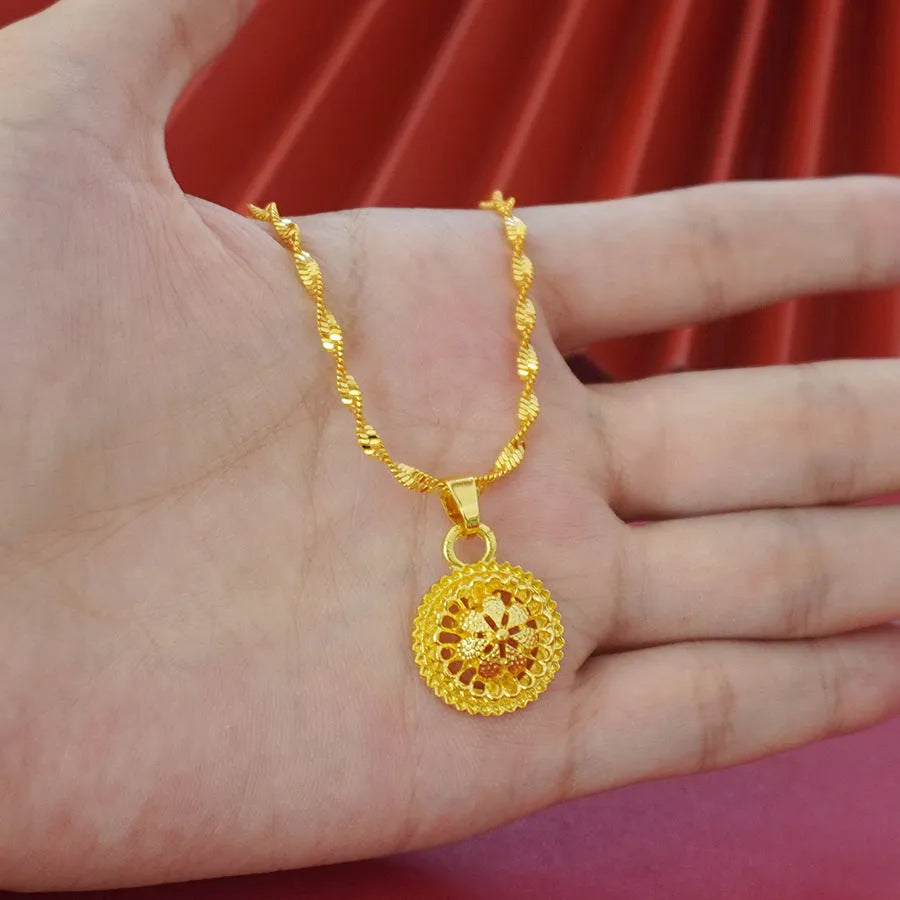 Gold electroplated floral design three-piece jewellery set showing necklace, earrings, and ring on water wave chain.