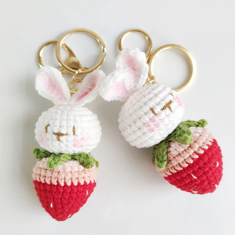 White hand-woven rabbit strawberry pendant charm with key attachment on four-strand doll wire
