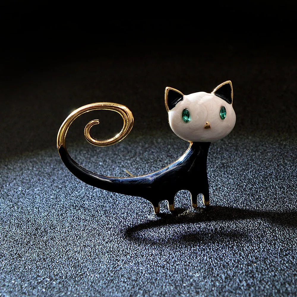 Personalized painted alloy brooch showing a cat with its tail up, in white and orange colour options.