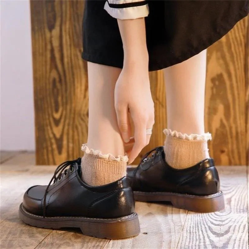Women's black retro college-style Mary Jane shoes with square low heel and front lace-up closure