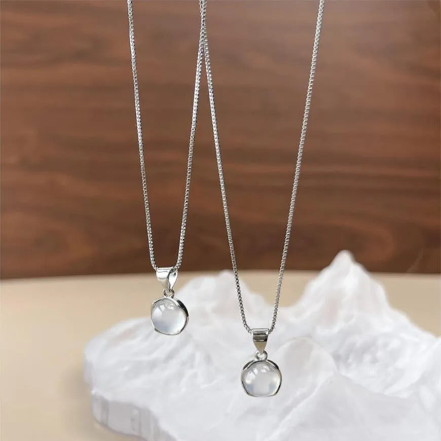 Oval artificial crystal pendant necklace with eight-point star design on adjustable box chain