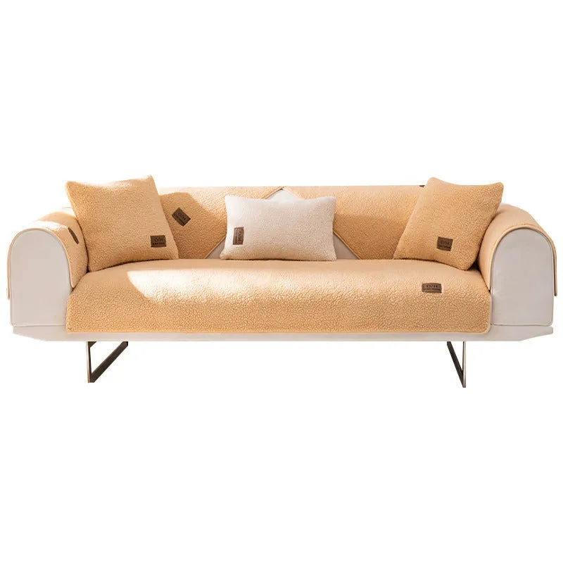 Lambswool sofa slipcover in a solid colour draped over a sofa, showing its simple cloth liner style.