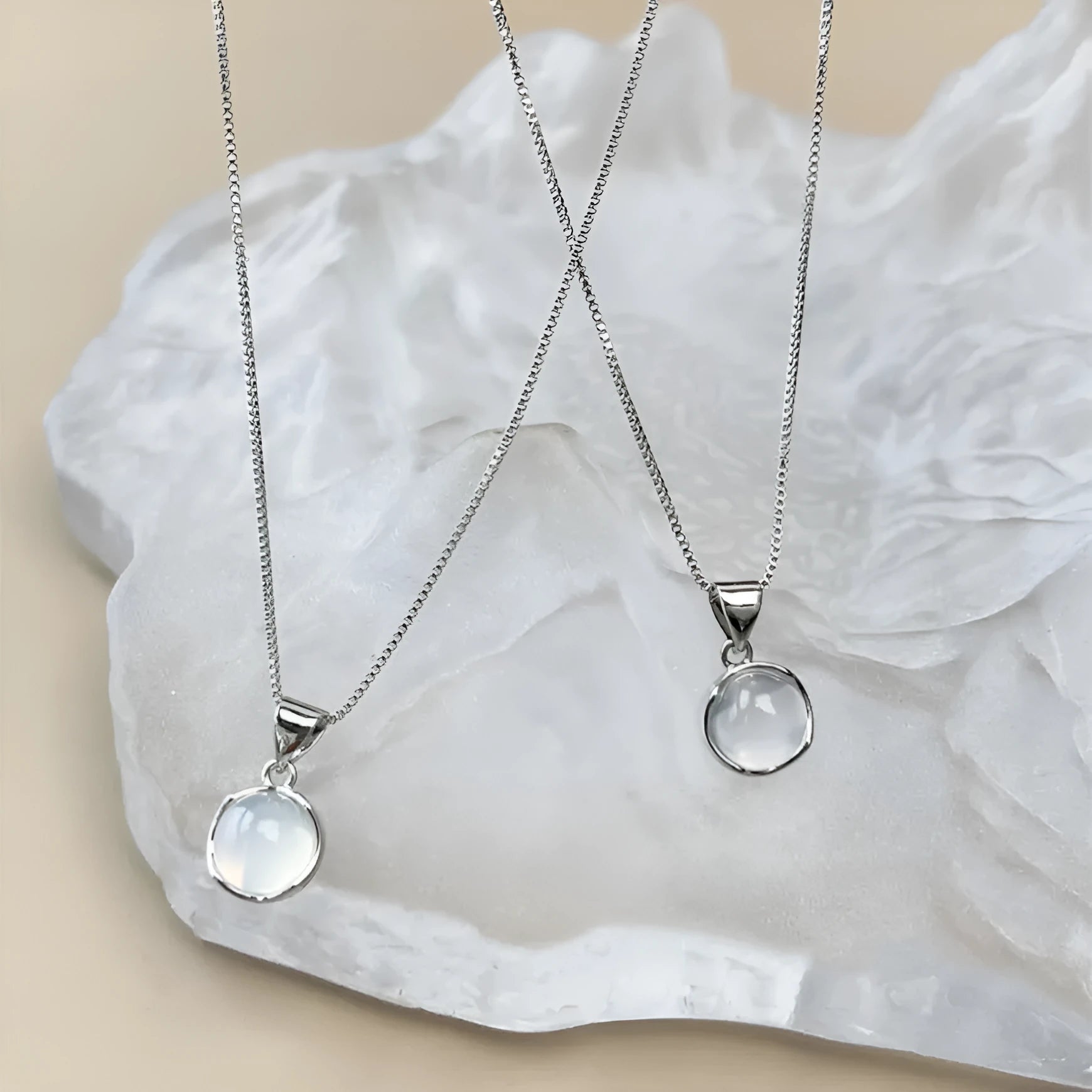 Oval artificial crystal pendant necklace with eight-point star design on adjustable box chain