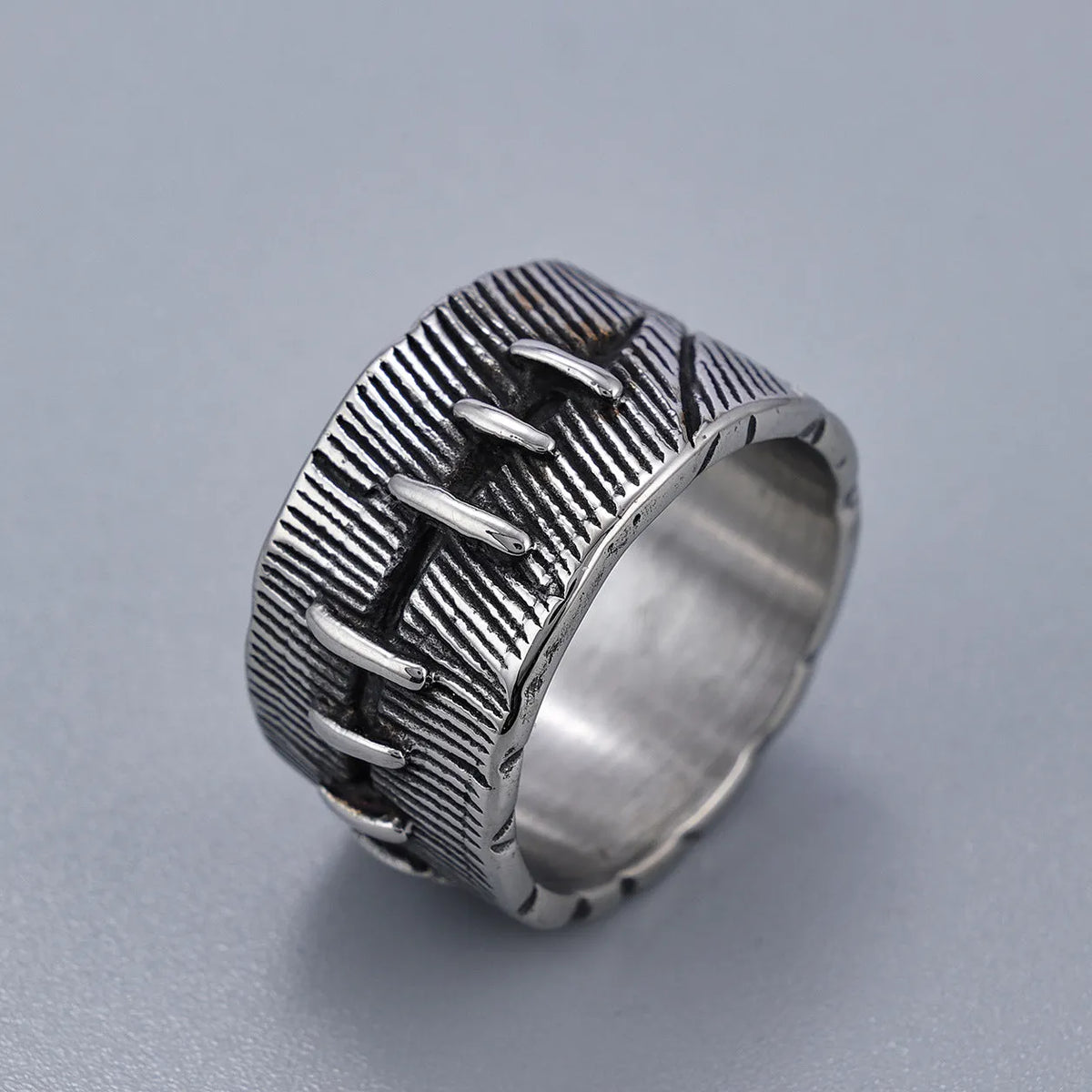 Dark punk titanium steel ring with geometric U-shape and stitched double ring design