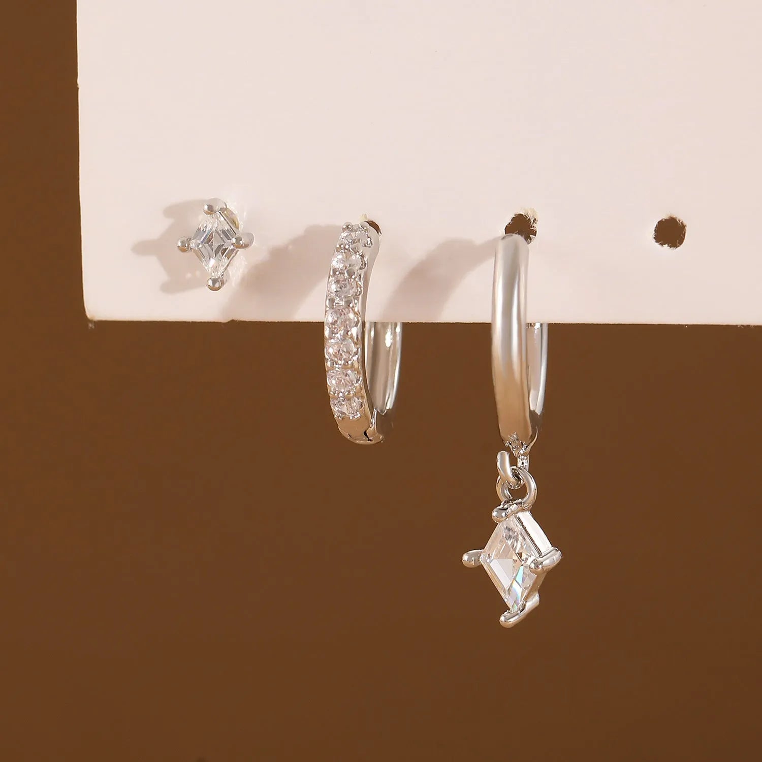 Ladies three-piece zircon earring set with geometric rhombus designs in gold and white colours