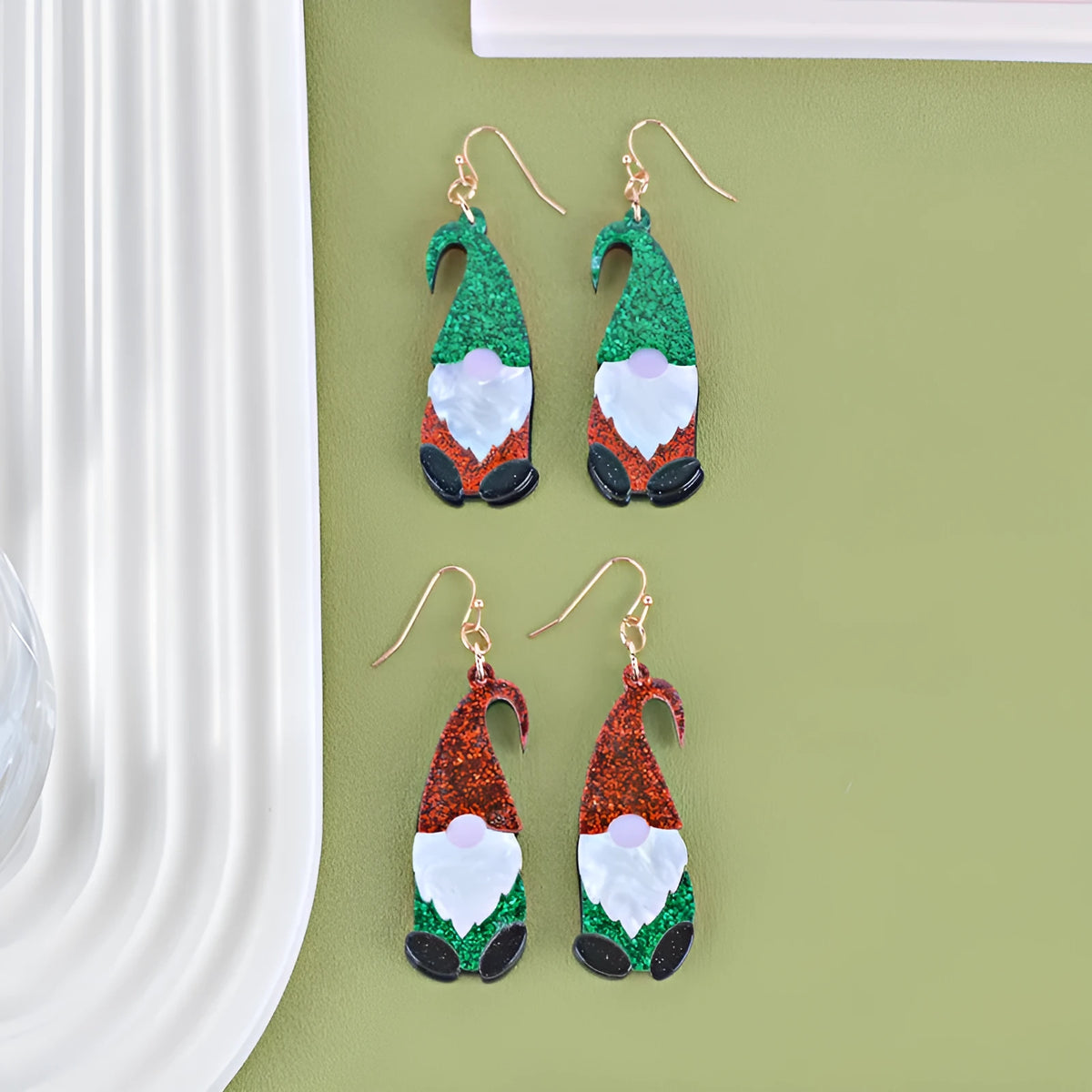 Acrylic Santa Claus cartoon character fashion earrings showing red, green, and red-green hat style options.