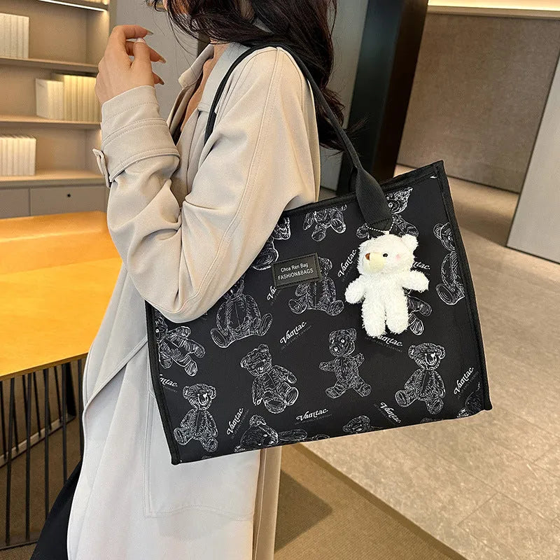 Women's black canvas tote bag with rhombus pattern and sandwich pocket