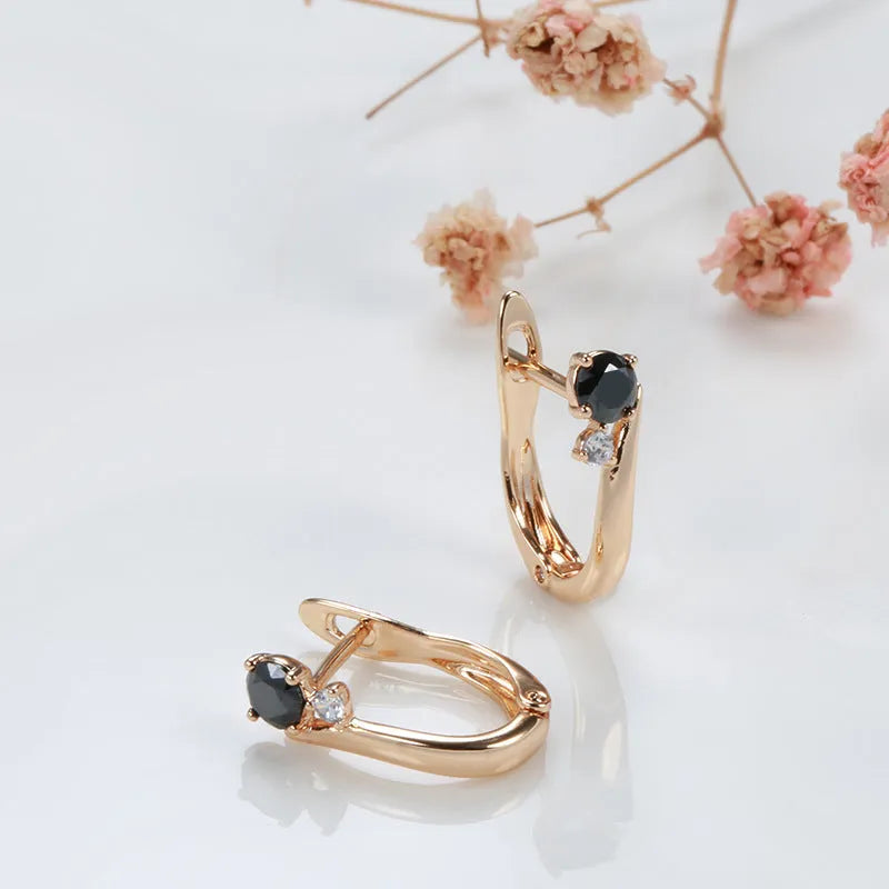 Women's black agate drop earrings with geometric design in gold-plated copper setting