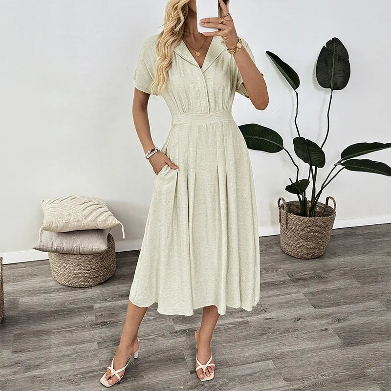 Light green women's shirt dress with lapel collar, waist tie, and side pockets.