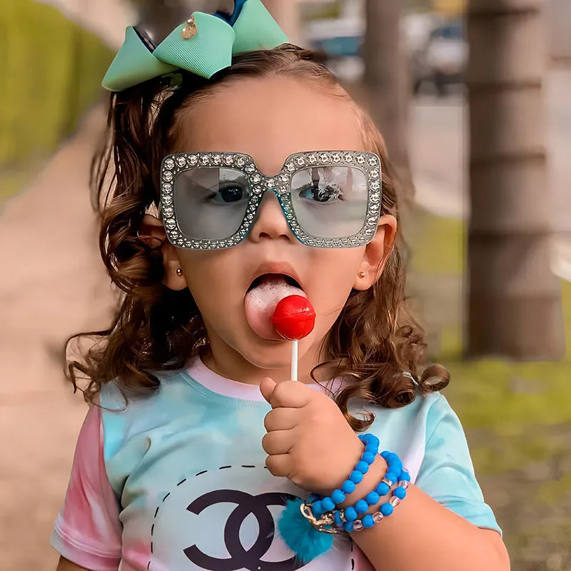 Plastic fashion sunglasses in a box showing various frame and lens colour options.
