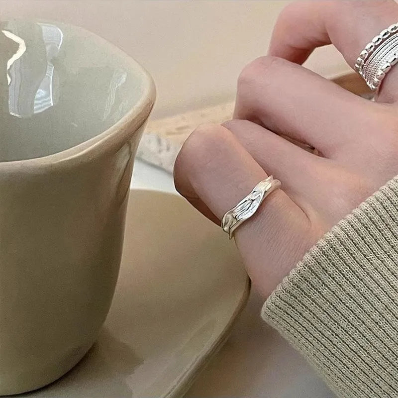 Adjustable copper alloy ring with woven twisted multilayer geometric design