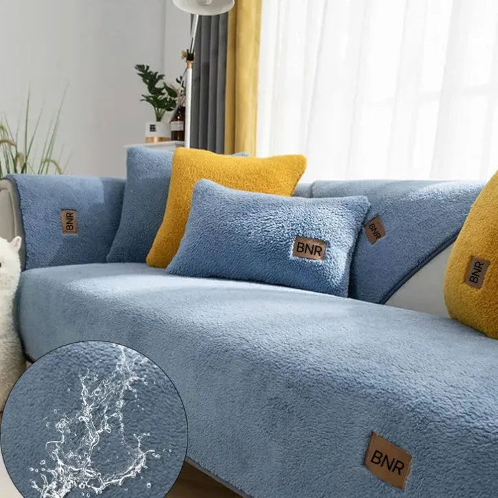 Lambswool sofa slipcover in a solid colour draped over a sofa, showing its simple cloth liner style.