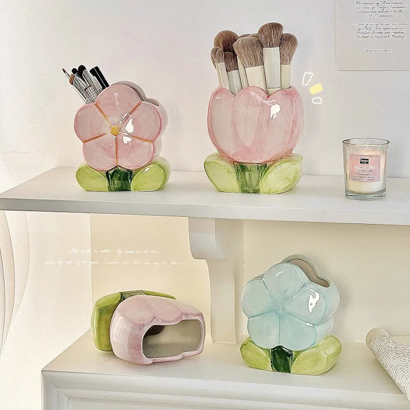 Ceramic desktop pen holder box with floral design in blue, pink, or purple.