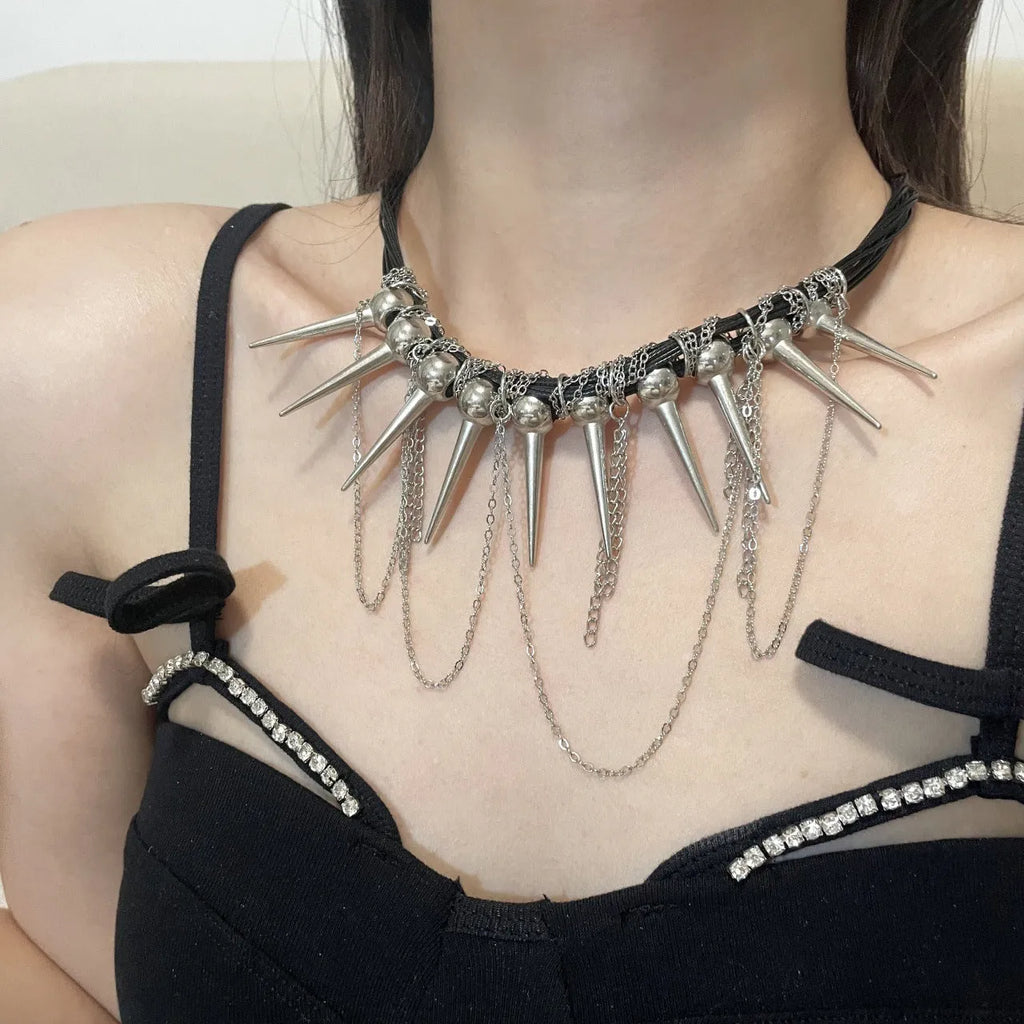 Women's leather tassel necklace with round beads and rivet detailing in electroplated finish