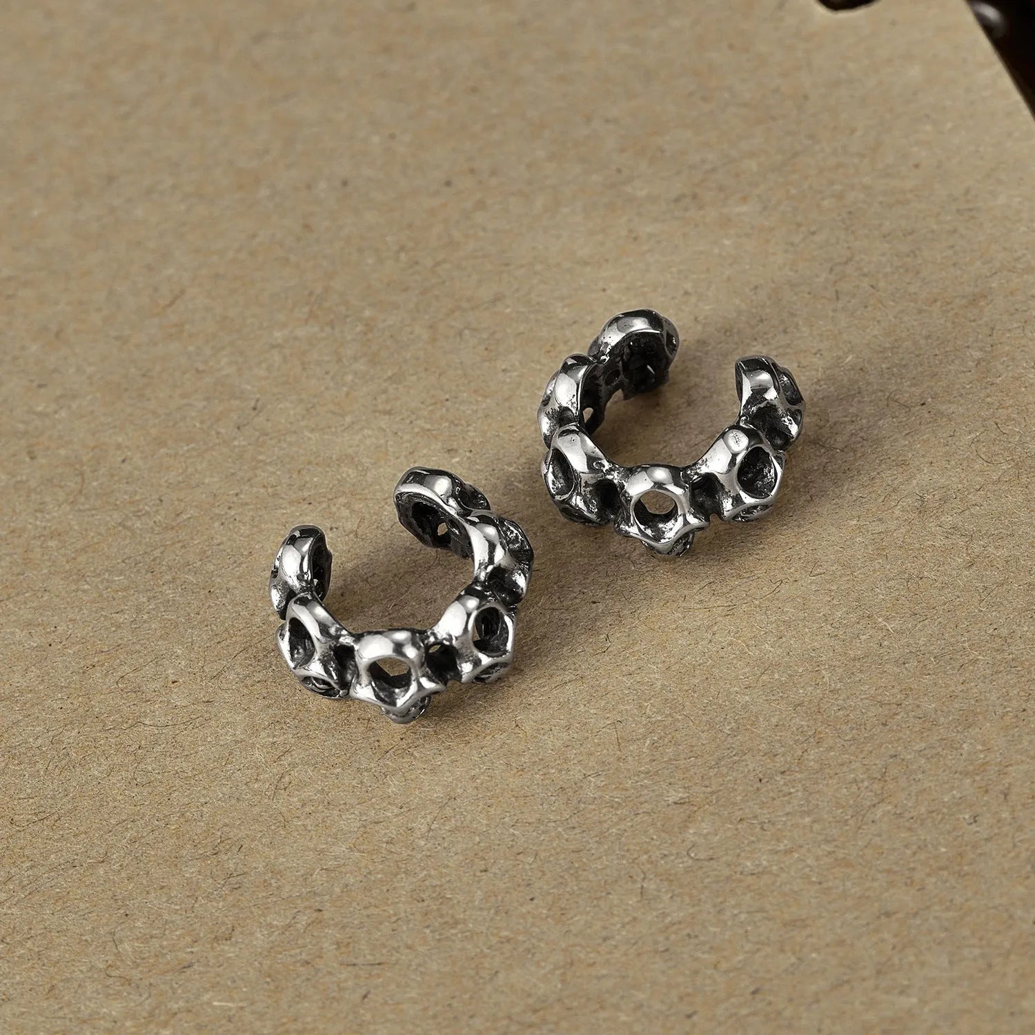 Stainless steel skull ear clips with hollow geometric design and clip mechanism