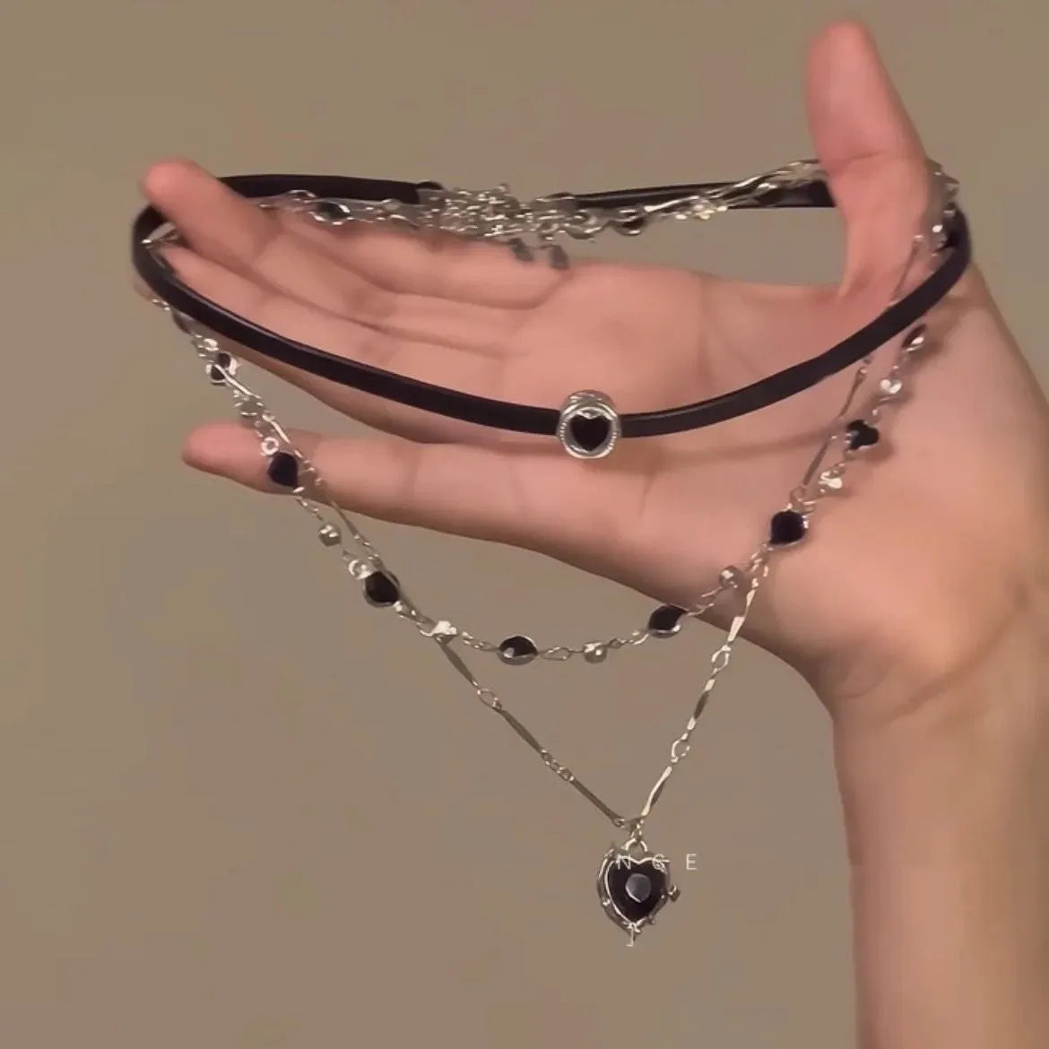 Women's multi-layer twin necklace set with leather heart pendants and adjustable clavicle chain
