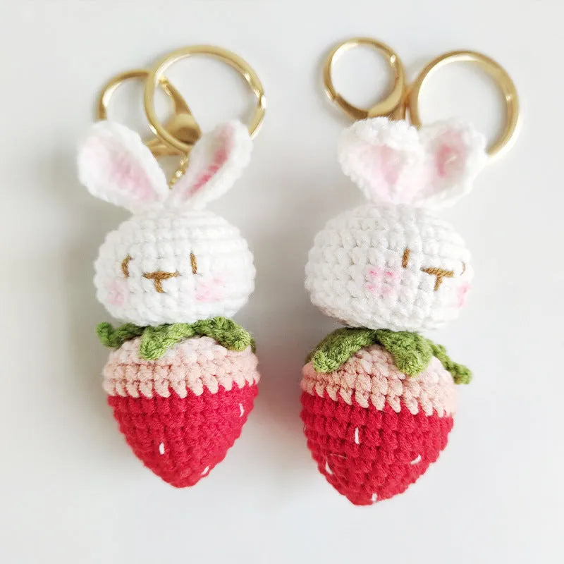 White hand-woven rabbit strawberry pendant charm with key attachment on four-strand doll wire