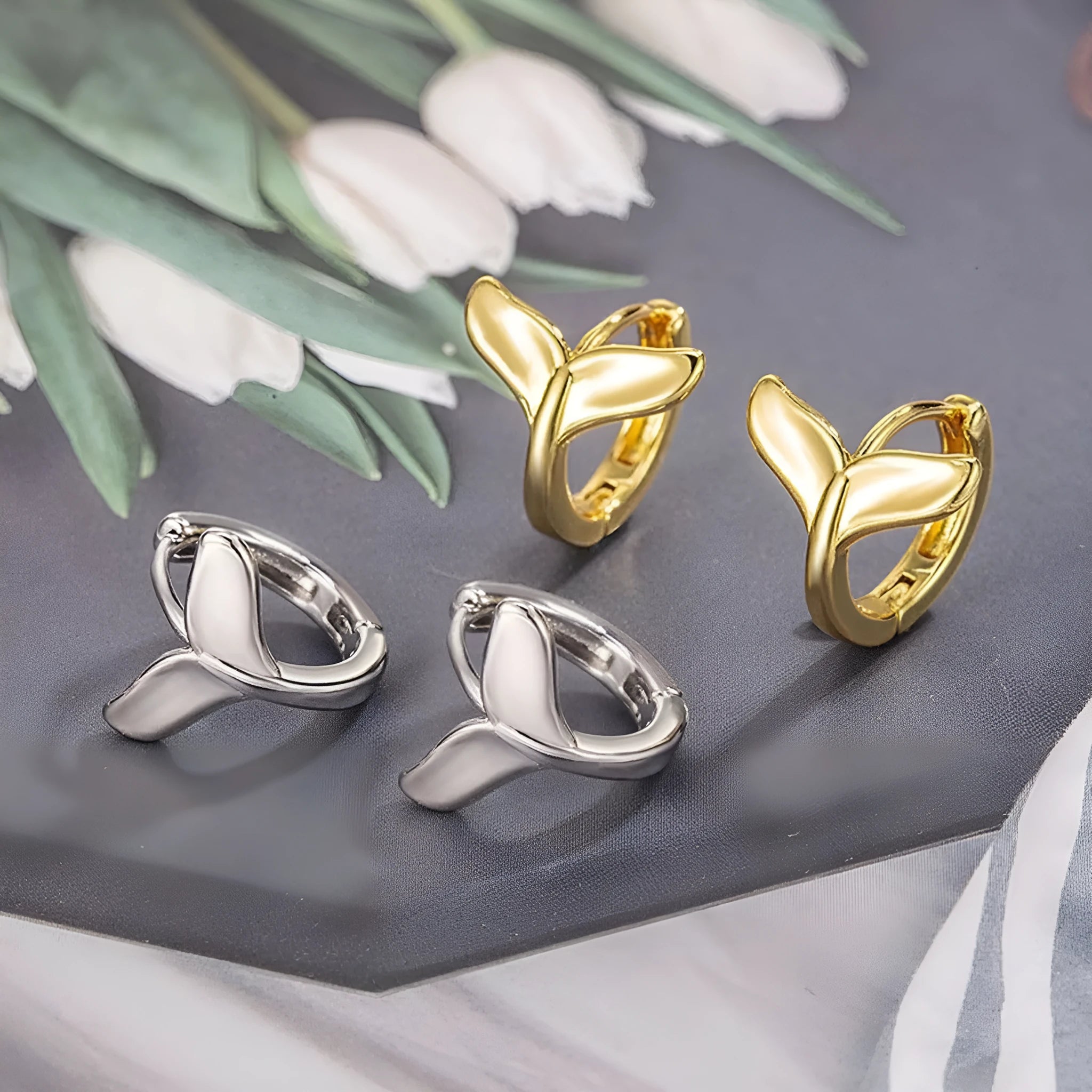 A pair of women's simple fishtail design earrings with an electroplated finish in a choice of colours.