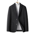 Men's slim fit wool suit jacket in grey, shown on a model, suitable for autumn and winter leisure wear.