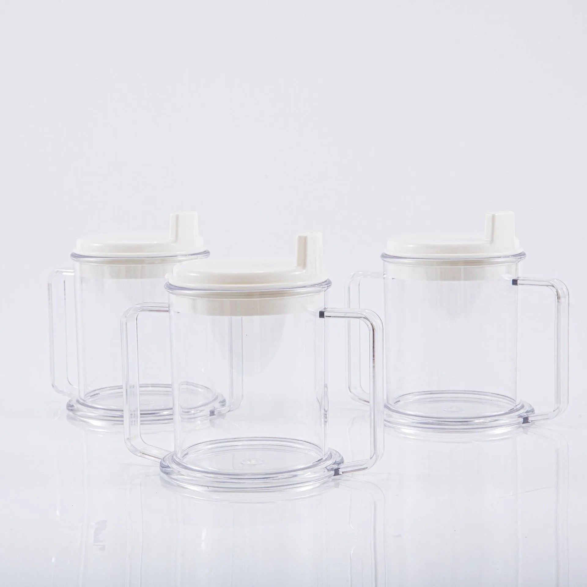 Clear transparent plastic spill-proof drinking cup with modern design.