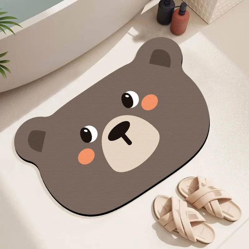 Thickened diatom ooze absorbent bathroom mat with cartoon animal design on a bathroom floor.